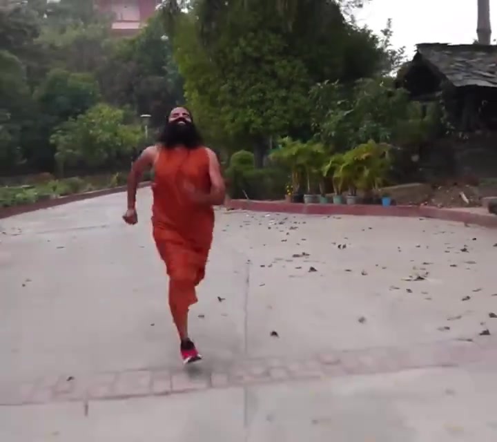Baba Ramdev sprinting in saffron robes
