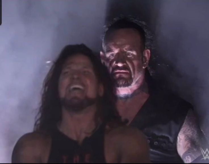 The Undertaker appearing behind AJ Styles